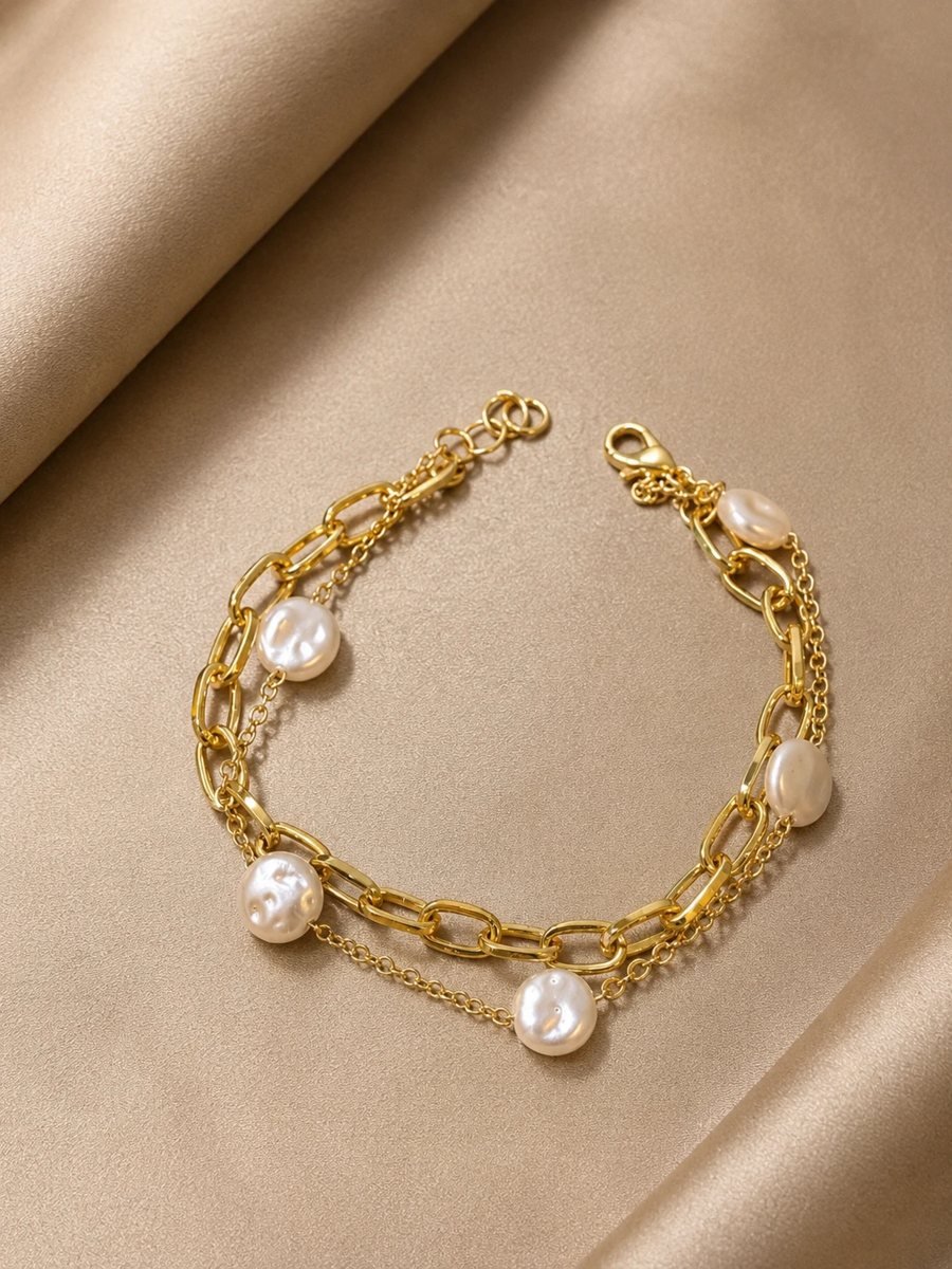 Gold chain bracelet with baroque pearls on satin